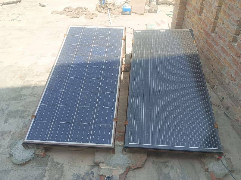 2 Solar plates, 2 stands, 1 inverter 0