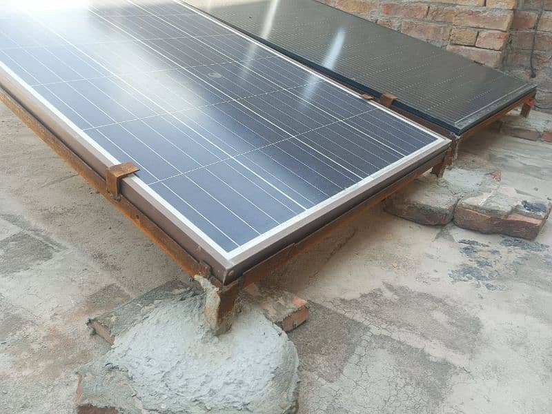 2 Solar plates, 2 stands, 1 inverter 6