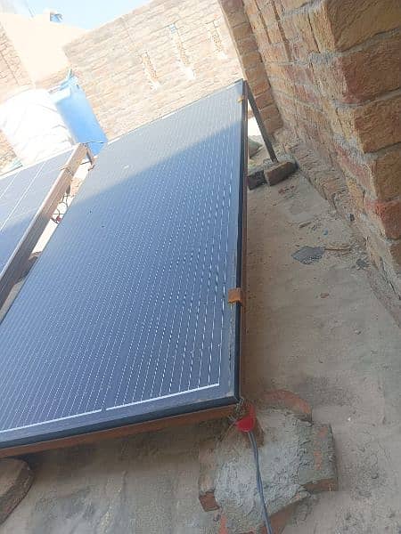 2 Solar plates, 2 stands, 1 inverter 9