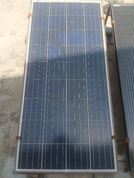 2 Solar plates, 2 stands, 1 inverter 11