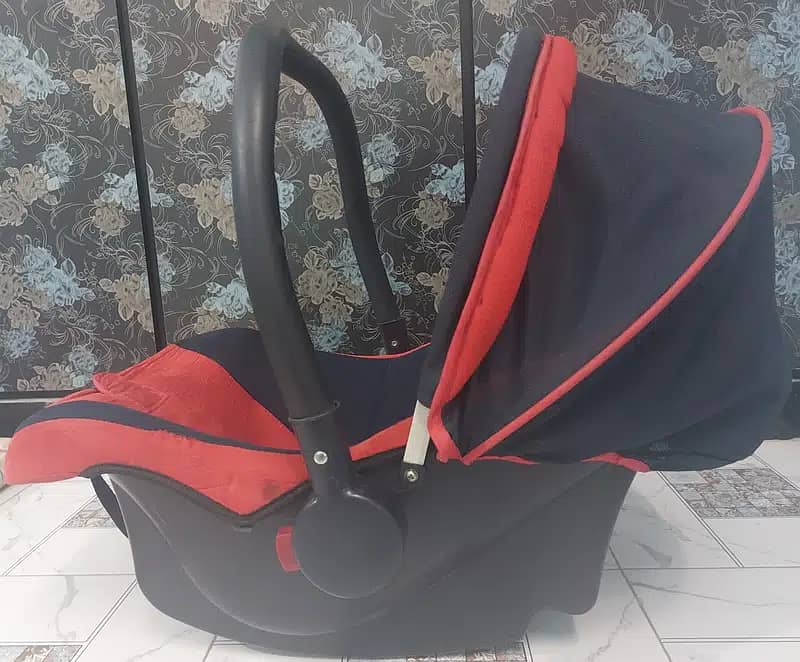 Branded red carry cot for kids 1