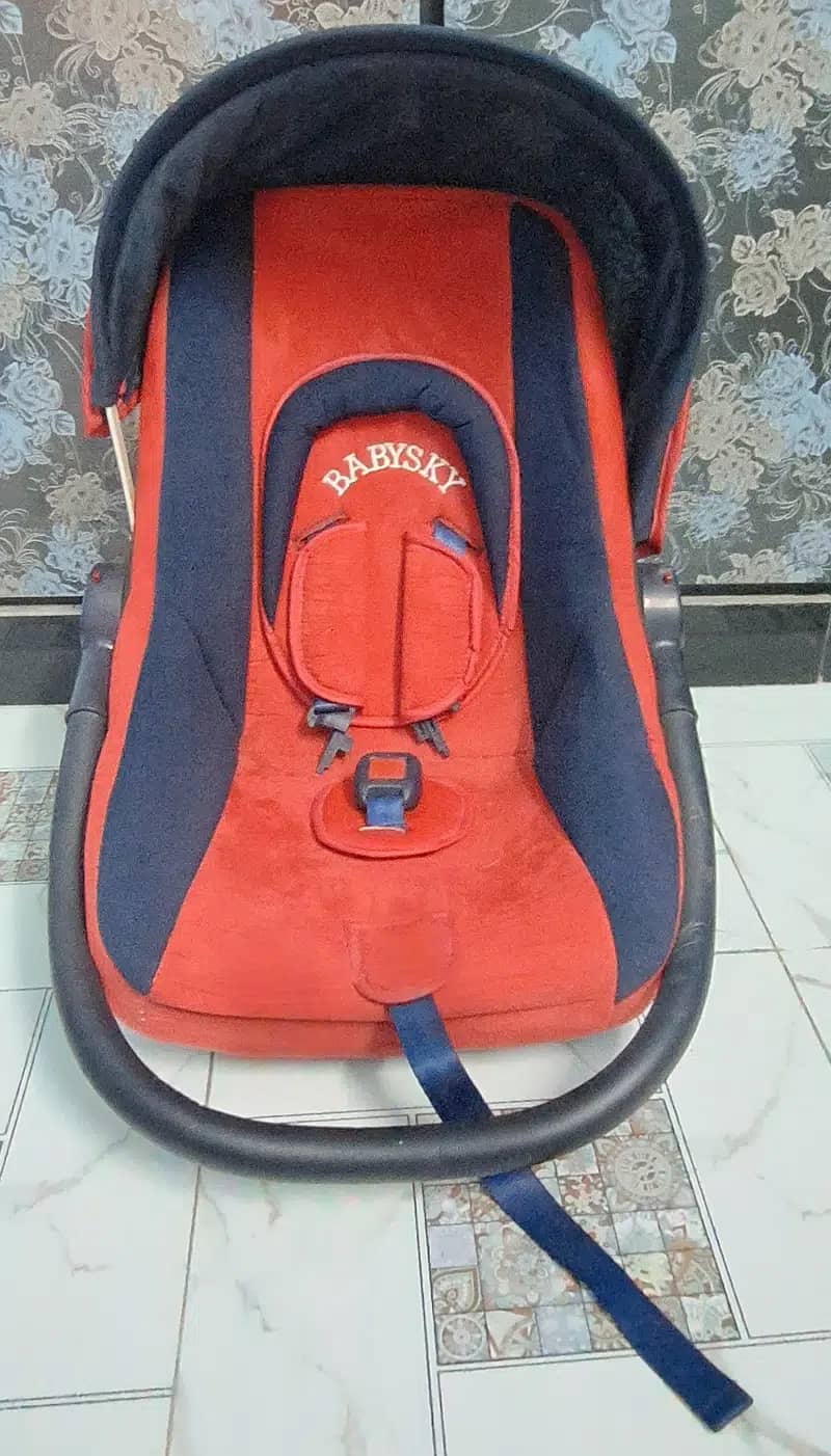 Branded red carry cot for kids 3