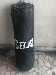 boxing bag with two gloves colour black