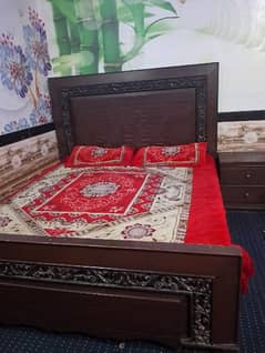 bed with mattress and 2 said table