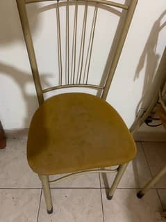 4 chairs and 1 steel and mirror table in goodest condition