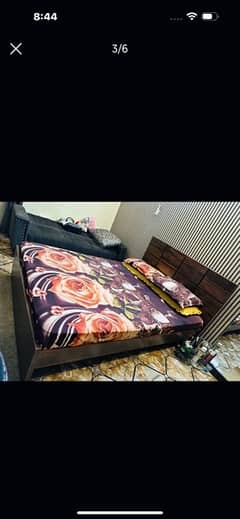 wooden bed with mattress ( little crack on left side of bed )