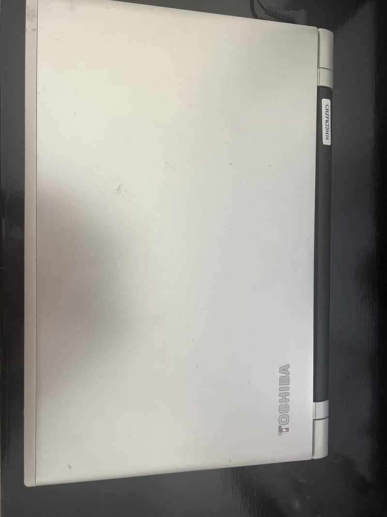 Silver coloured Toshiba laptop with 101GB storage for sale. 0