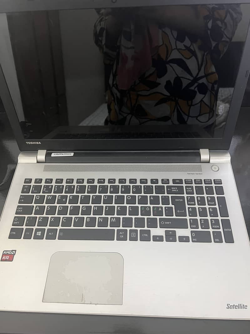 Silver coloured Toshiba laptop with 101GB storage for sale. 1