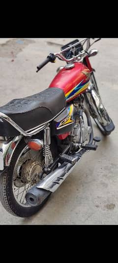 Honda 125 with golden number