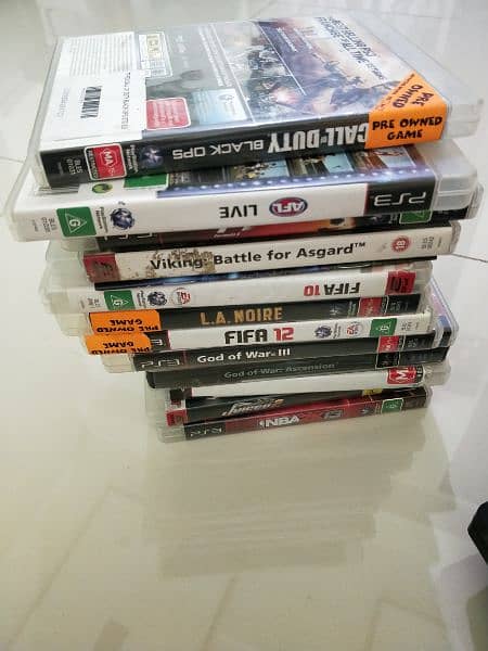 ps3 for sell with 12 cds 2