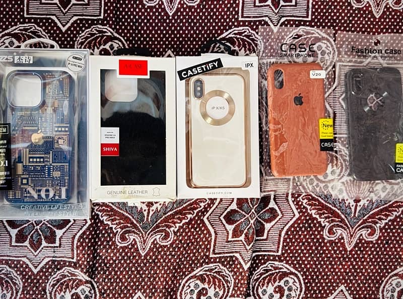 Iphone 14 pro max 2 cover 1 leather cover and 3 Iphone x/xs covers. 0