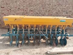 Wheat drill with fertilizer attachment