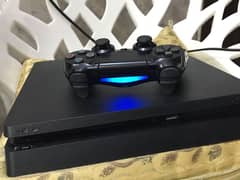 PS4 with 2 controllers and games