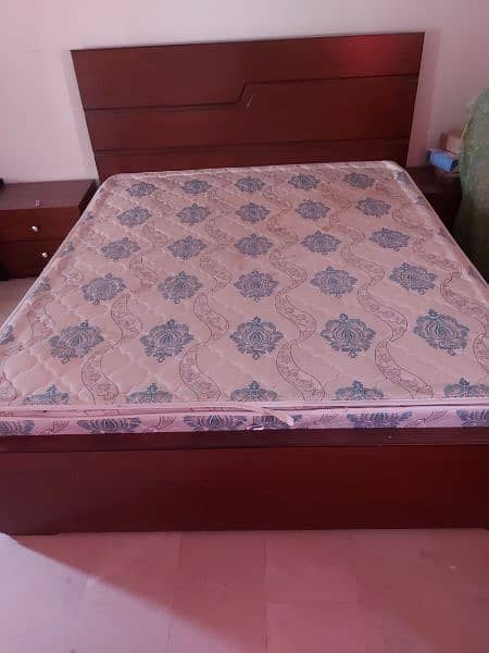 A wooden king size double bed with 9 inch spring matras 2