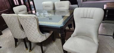 Wooden dining table with 6 sofa chairs,had glass on top of the table