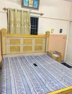 wooden bed with mettress