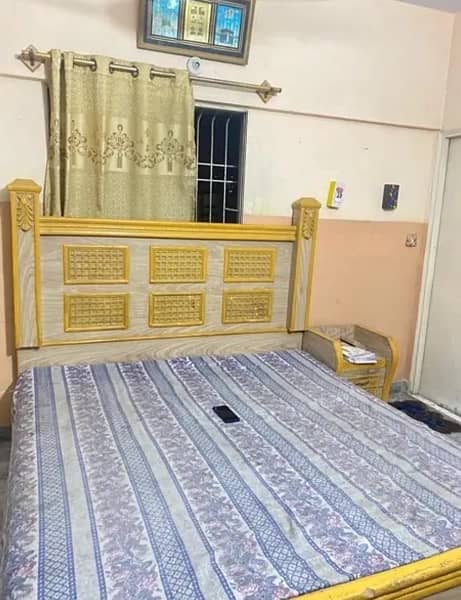 wooden bed with mettress 0