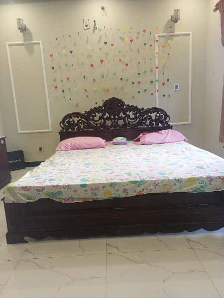 vintage style bed with beautifully designed head bored 0