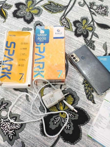 Tecno spark 7t  4/64 with box charger urgent sale 7