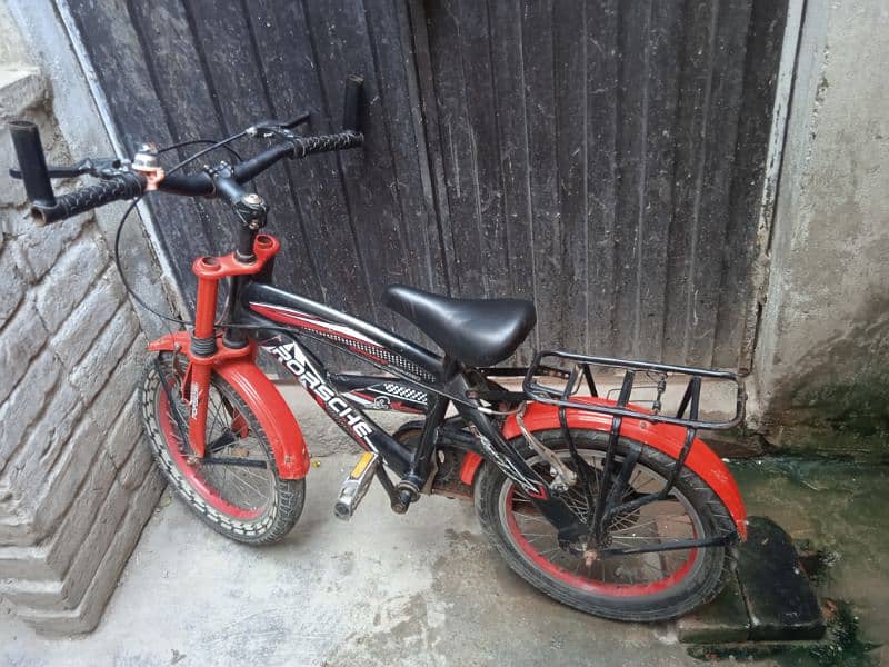 RED & BLACK BICYCLE FOR SALE . . . USE age 7 to 10 year child 0