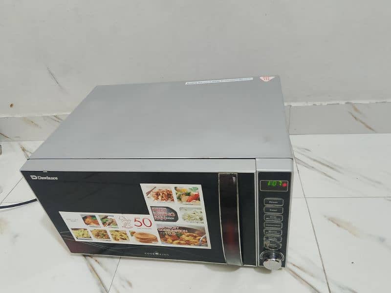 Dawlance microwave oven 3 in 1 grill baking microwave h vip condition 2