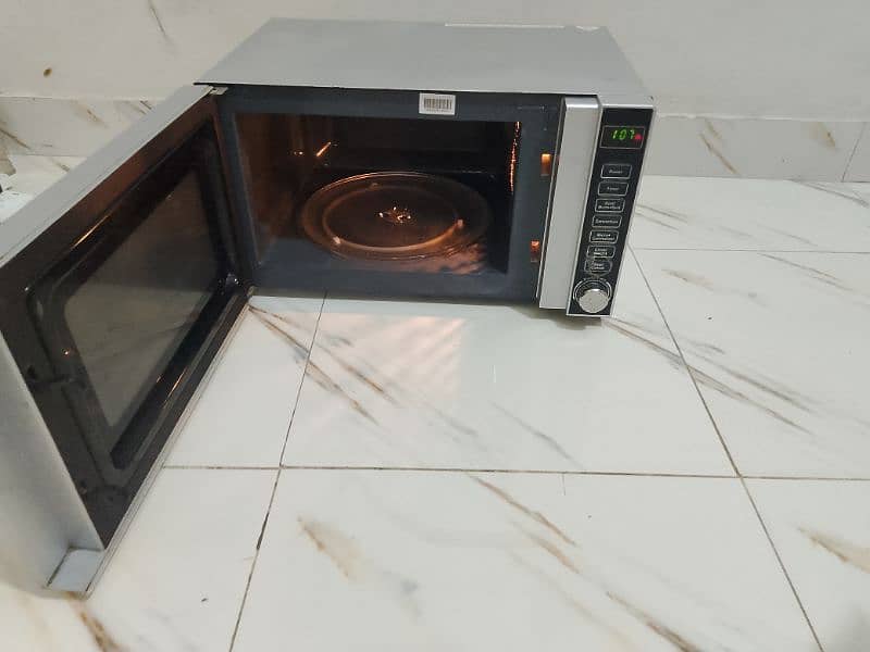 Dawlance microwave oven 3 in 1 grill baking microwave h vip condition 4