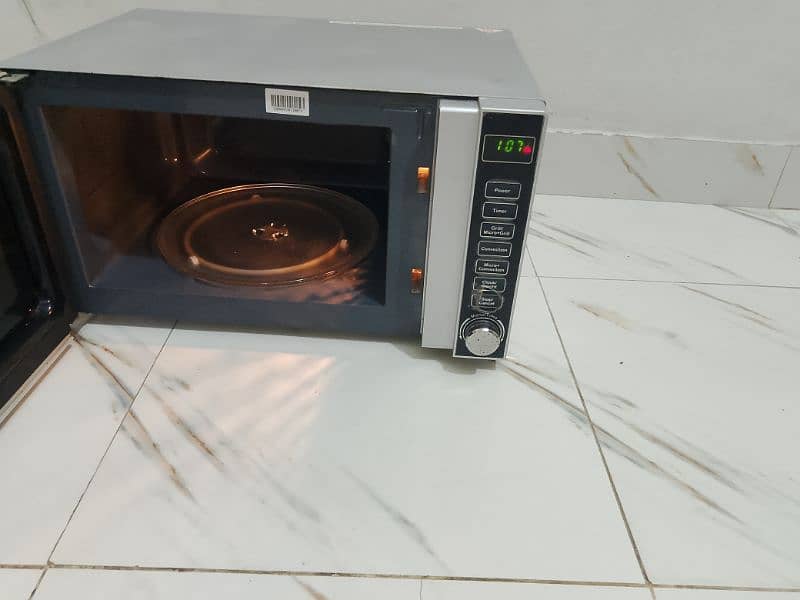 Dawlance microwave oven 3 in 1 grill baking microwave h vip condition 6