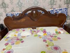 King size wooden bed with side tables and dressing table