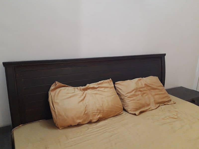 wooden bed with mattress and side table 2