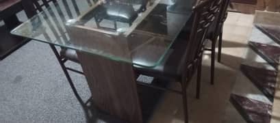 Glass top dining table with 4 strong Iron chairs