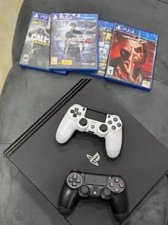 PS4 Pro with 2 controllers nd 5 CD’s Neat nd clean console