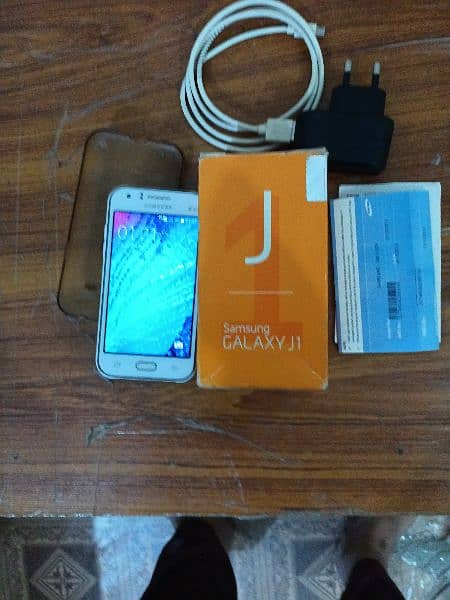 samsung Galaxy j1 with box and charger 1