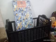 Baby Cot with mattress.