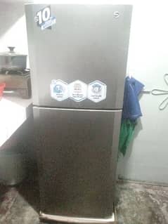 medium size fridge with wranty card and keys