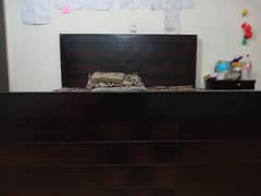 Wooden double bed with mattress