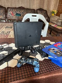 ps4 slim 500gb along three controller, six games and a camera