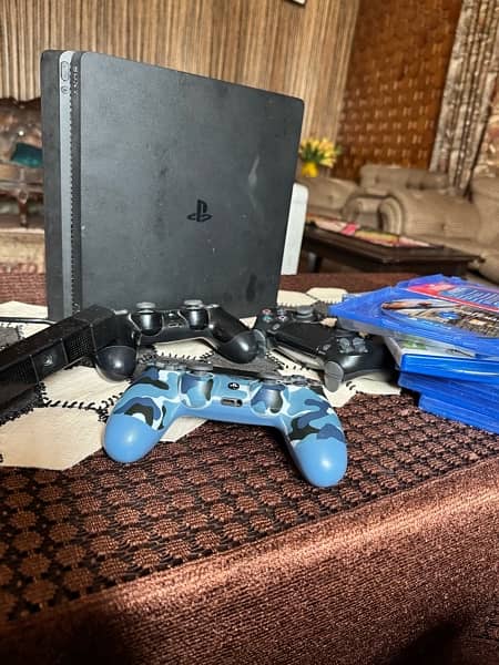 ps4 slim 500gb along three controller, six games and a camera 1