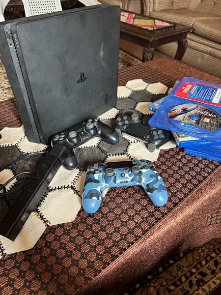 ps4 slim 500gb along three controller, six games and a camera 3