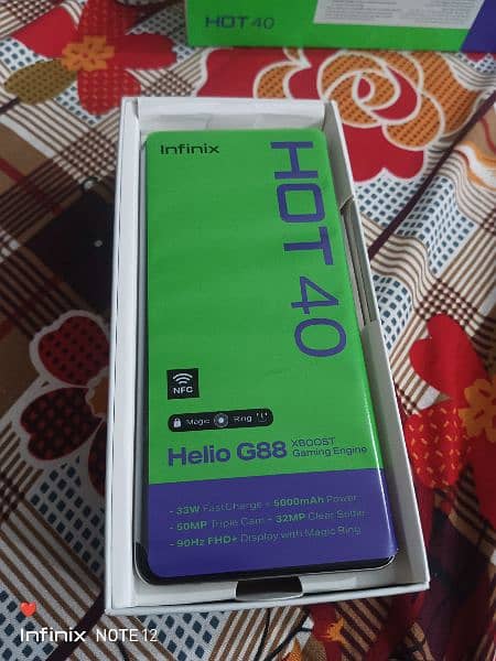 infinix hot 40Condition 10/10 with warranty just box open not use 12