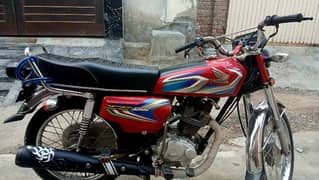 I am selling honda 125 10/10 condition in red colour 0