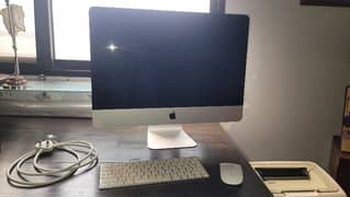 Apple iMac 21 inch desktop (consider new)