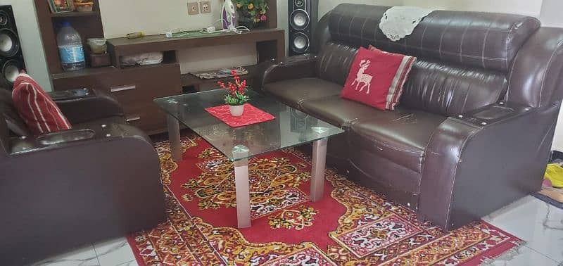 3 seater and 1 stear lather poshish sofa with glass table 3