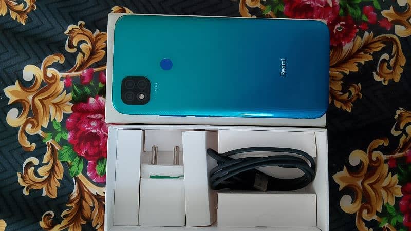 REDMI 9C WITH BOX AND CHARGER 1