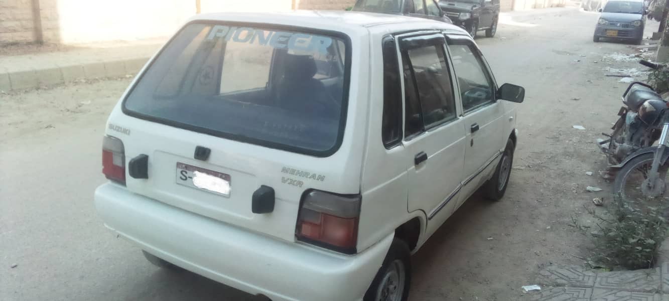 suzuki mehran 1991 model good condition white colour. petrol 10