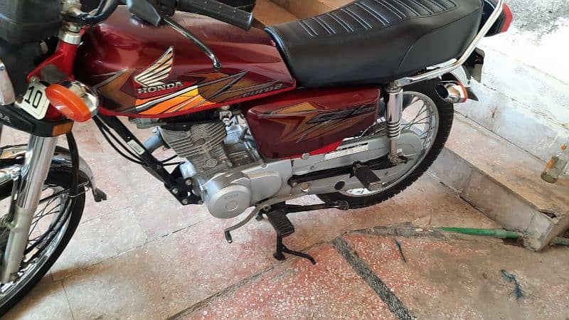 Honda 125 cc. total genuine. 5