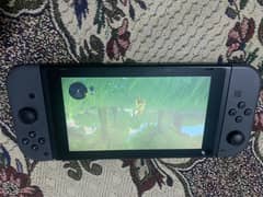 nintendo switch console with dock and controller