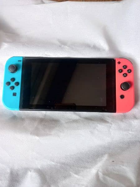 Nintendo Switch with box and other accessories with 3 games 9