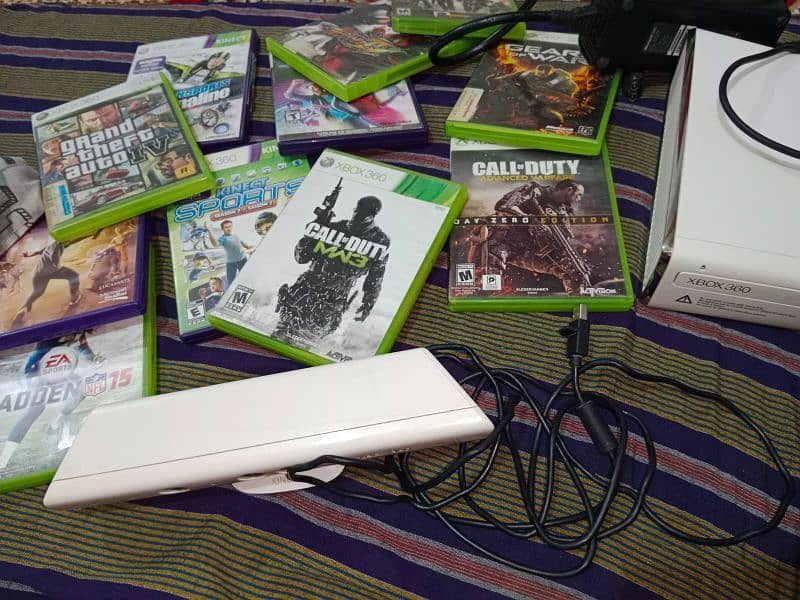 Xbox 360s with kinect sensor and games 2