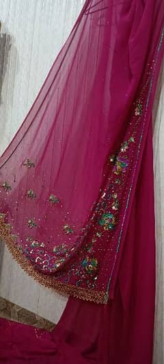 dark pink saree with multiple shading embroidery and with stone work