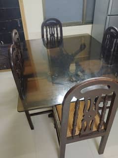 Glass dining table with chairs